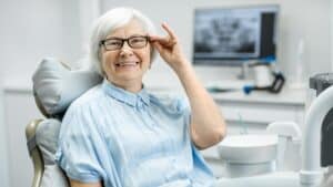 Portrait,Of,A,Beautiful,Senior,Woman,With,Healthy,Smile,Sitting